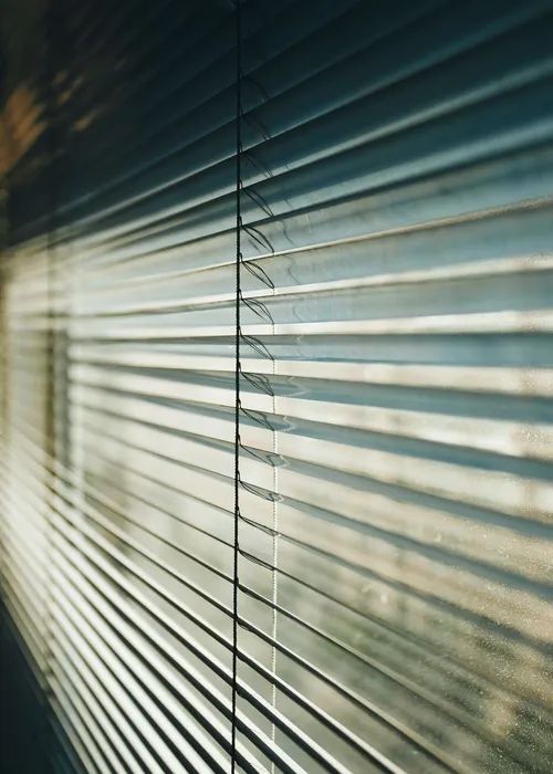 Close-up of a blind control cord and chain mechanism